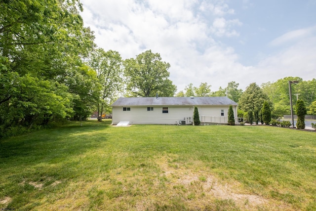 rear view of house with a lawn