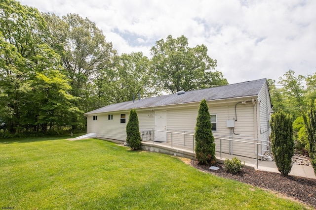 view of home's exterior with a lawn