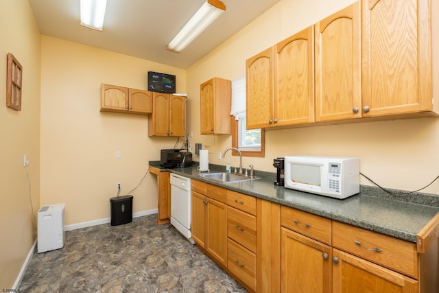 kitchen featuring sink and white appliances