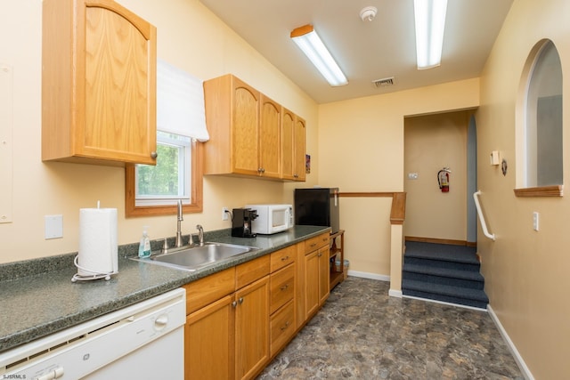 kitchen with sink and white appliances