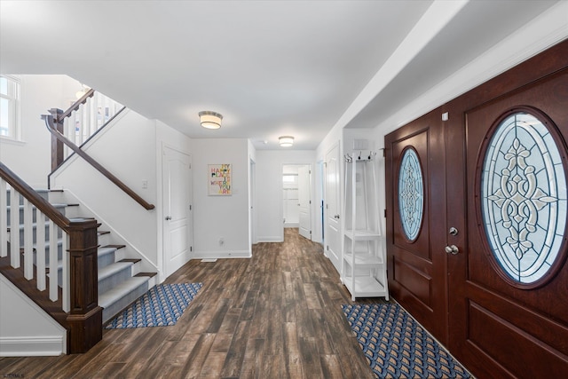 foyer entrance with dark hardwood / wood-style floors