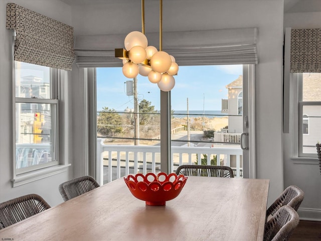 dining area featuring a notable chandelier