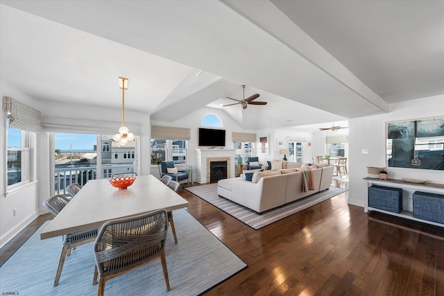 living room with dark wood-type flooring, ceiling fan, and vaulted ceiling