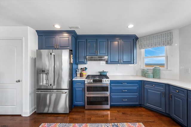 kitchen with decorative backsplash, dark wood-type flooring, stainless steel appliances, and blue cabinets