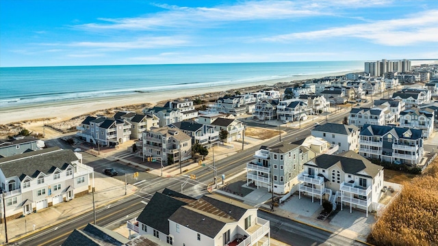 aerial view featuring a water view and a beach view