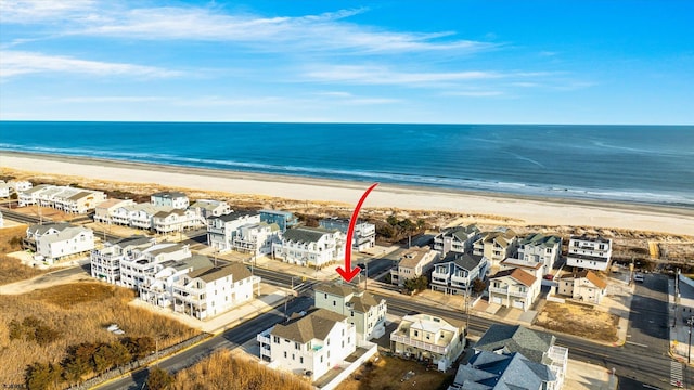 bird's eye view featuring a water view and a view of the beach