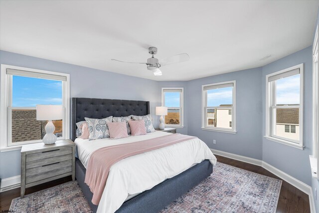 bedroom featuring dark wood-type flooring and ceiling fan