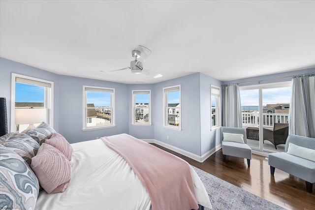 bedroom featuring hardwood / wood-style flooring, access to outside, and ceiling fan