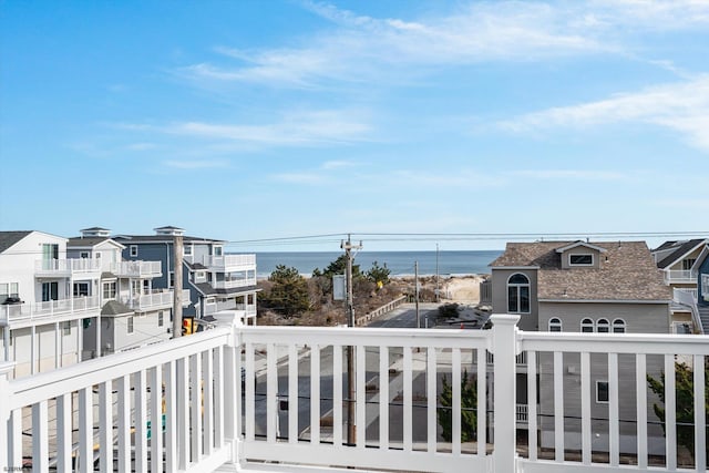 balcony featuring a water view