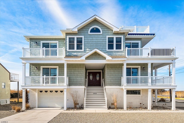 beach home featuring a garage and a balcony