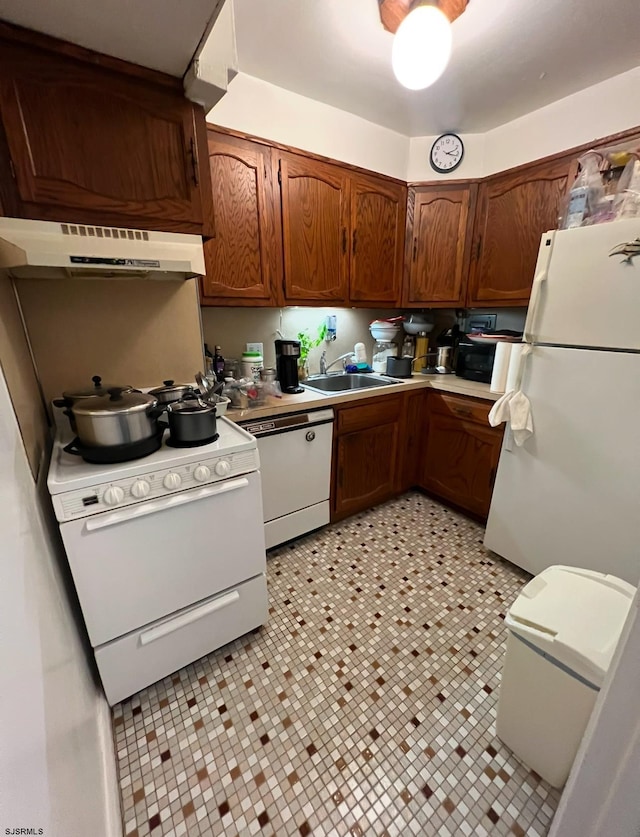 kitchen with sink and white appliances