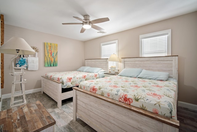 bedroom featuring wood-type flooring and ceiling fan