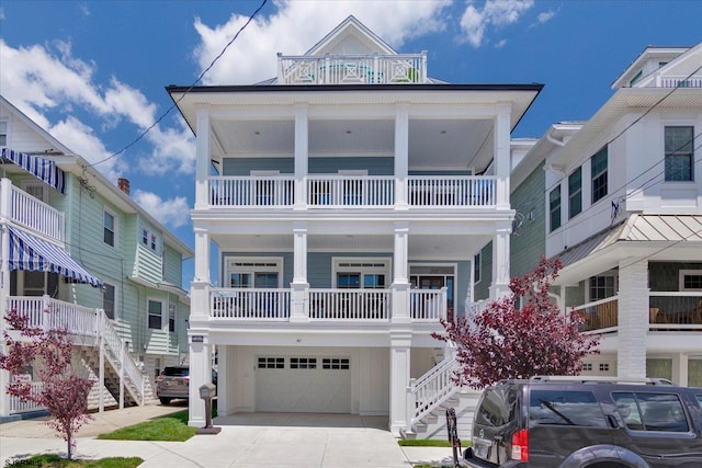 view of front of property featuring a garage and a balcony