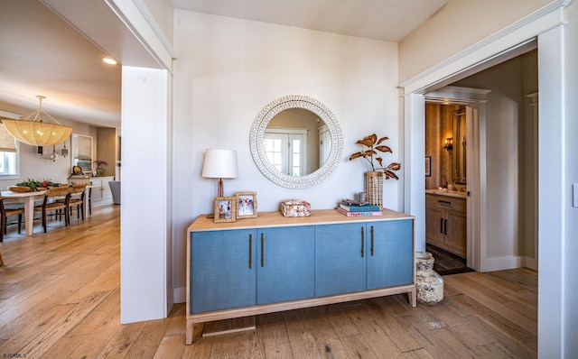 hall with light hardwood / wood-style flooring