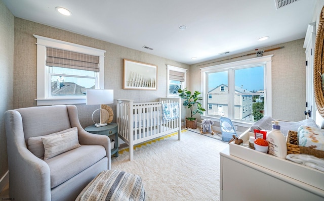 bedroom featuring light colored carpet