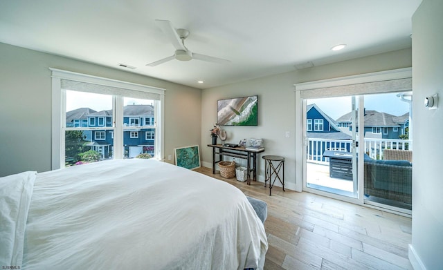 bedroom featuring ceiling fan, access to outside, and wood-type flooring