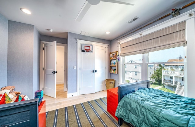 bedroom featuring wood-type flooring and ceiling fan