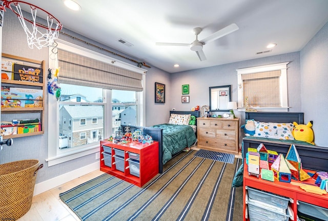 bedroom with hardwood / wood-style flooring and ceiling fan