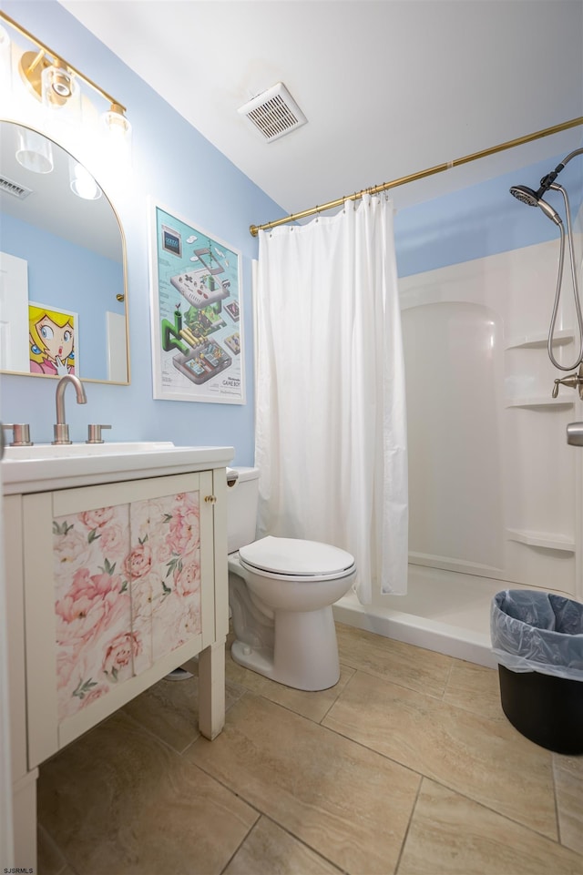 bathroom with vanity, tile patterned flooring, a shower with curtain, and toilet