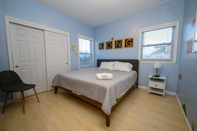 bedroom featuring a closet and light wood-type flooring