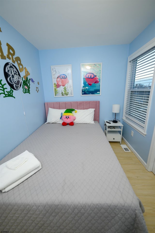 bedroom featuring hardwood / wood-style flooring