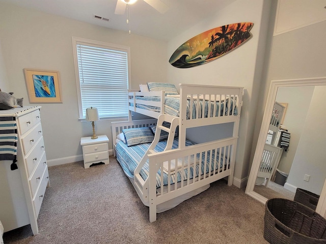 carpeted bedroom with a ceiling fan, visible vents, and baseboards