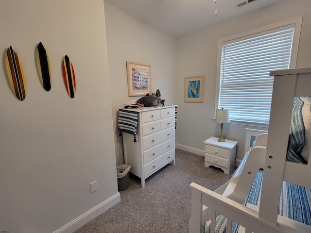 carpeted bedroom featuring visible vents and baseboards