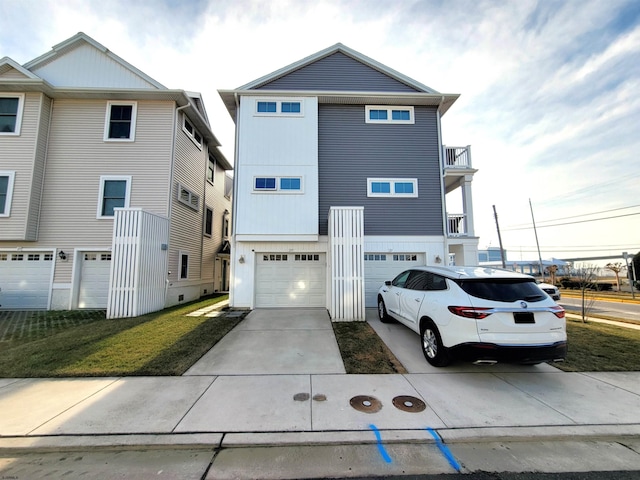 view of front facade with driveway, an attached garage, and a balcony