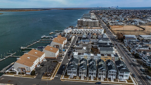 bird's eye view with a water view and a residential view