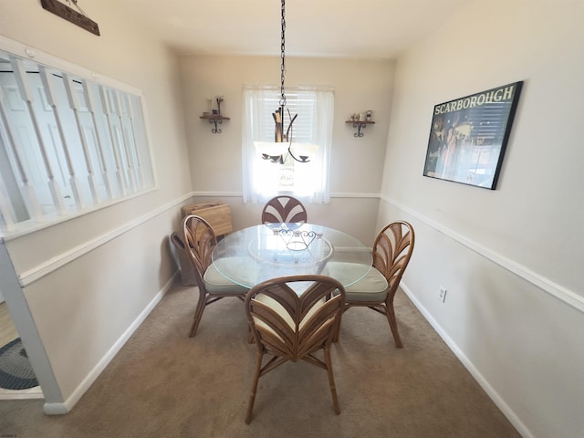 view of carpeted dining area