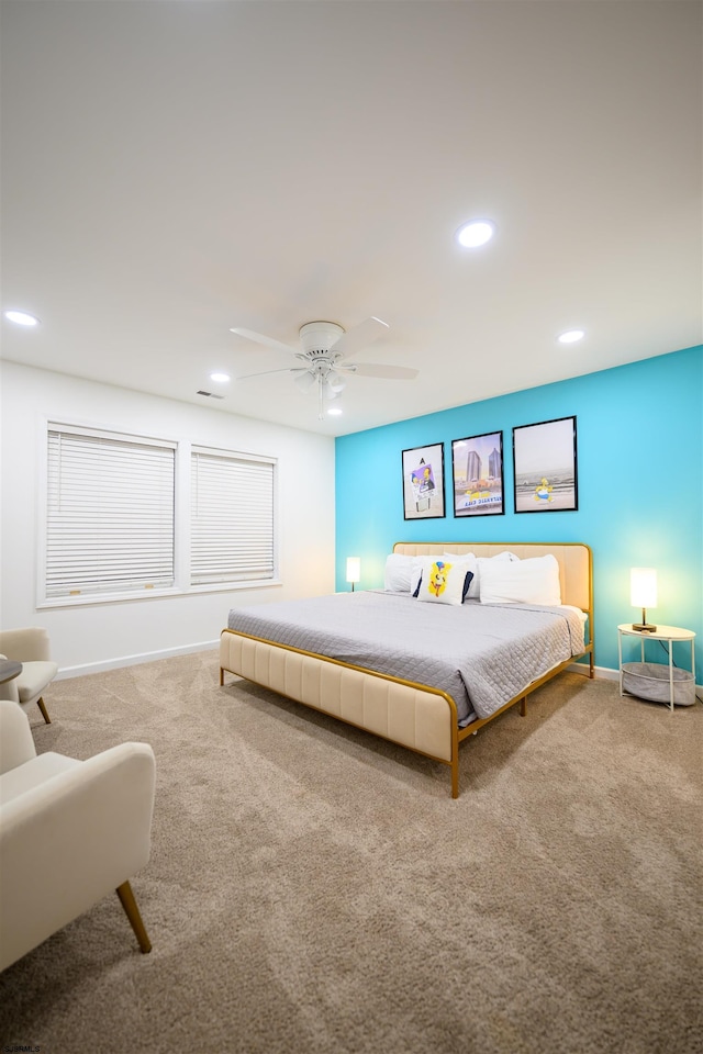 bedroom with ceiling fan and carpet flooring