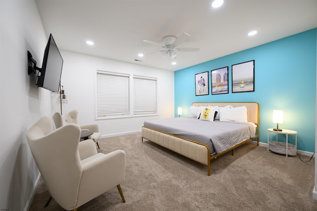 bedroom with light carpet and ceiling fan