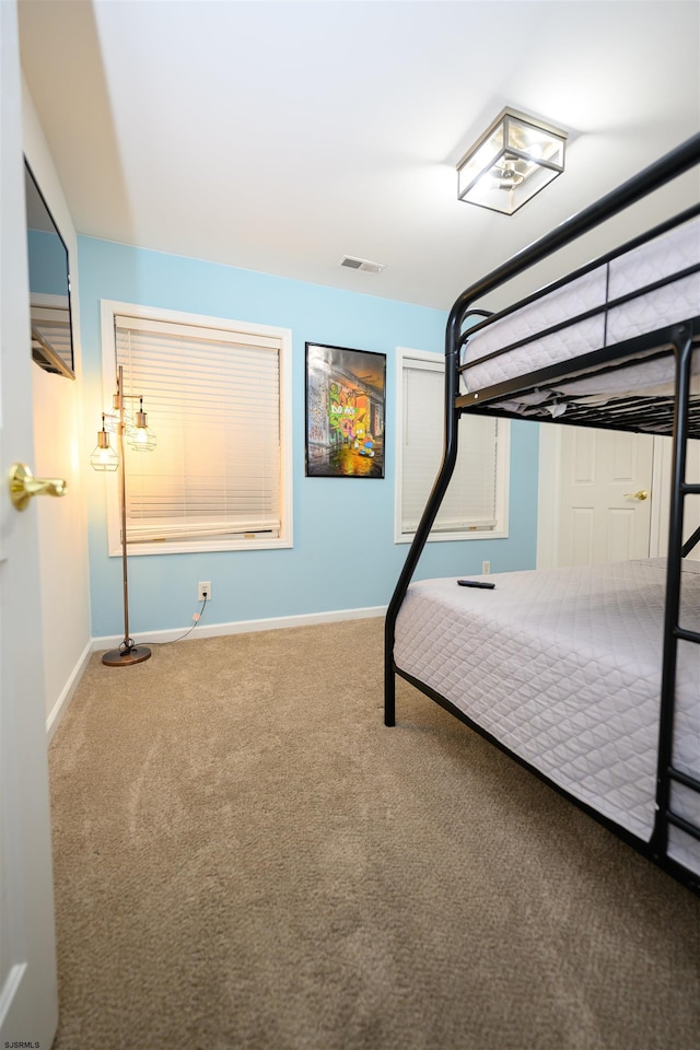 unfurnished bedroom with carpet floors