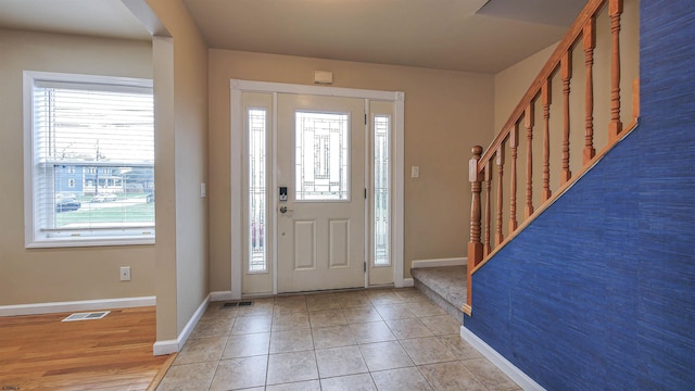 foyer featuring light tile patterned floors