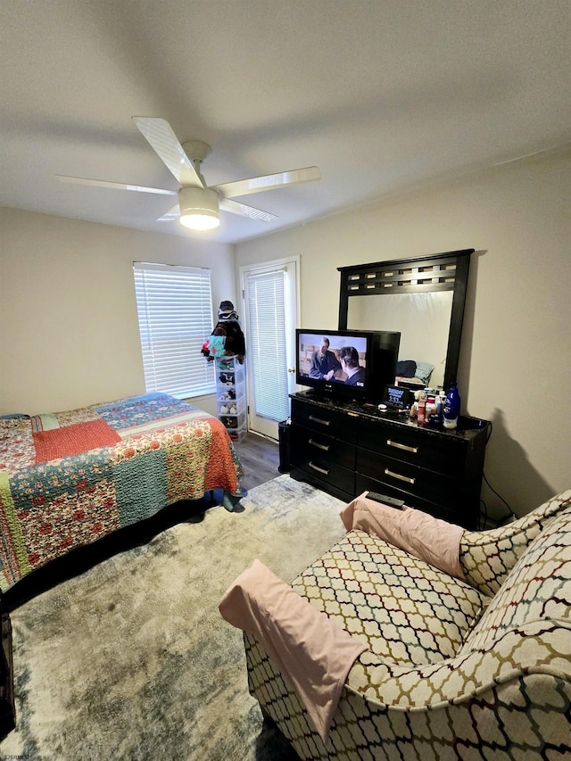 bedroom featuring ceiling fan and dark hardwood / wood-style flooring