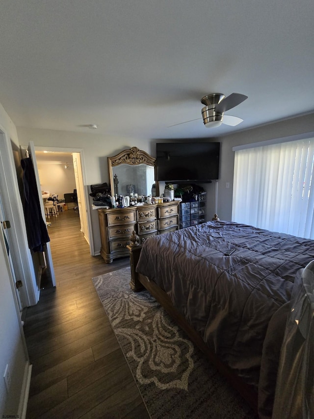 bedroom featuring dark hardwood / wood-style flooring and ceiling fan