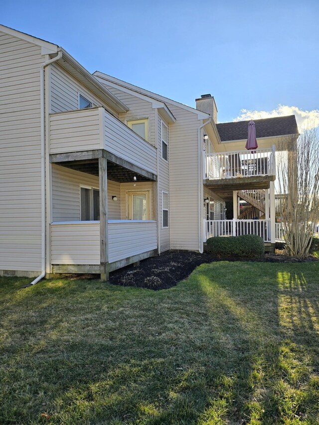 view of side of property with a yard