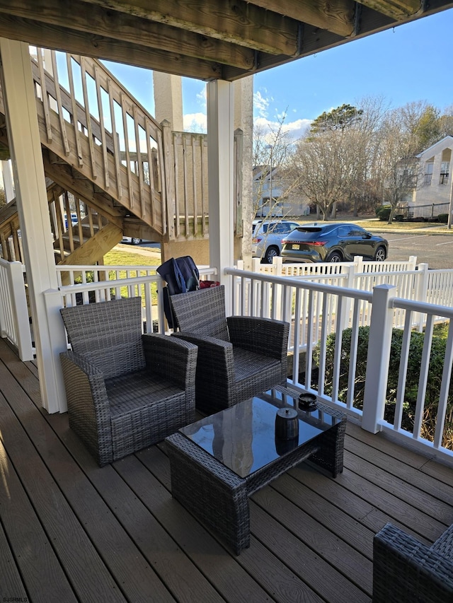 deck featuring outdoor lounge area and central air condition unit