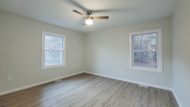 spare room with ceiling fan and light hardwood / wood-style floors