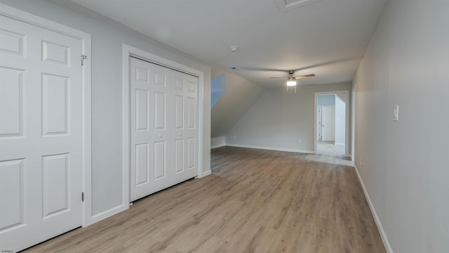 bonus room with ceiling fan, lofted ceiling, and light wood-type flooring