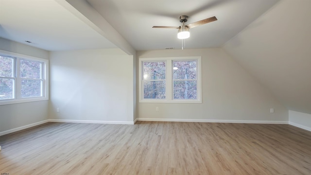 additional living space with vaulted ceiling, ceiling fan, and light hardwood / wood-style flooring