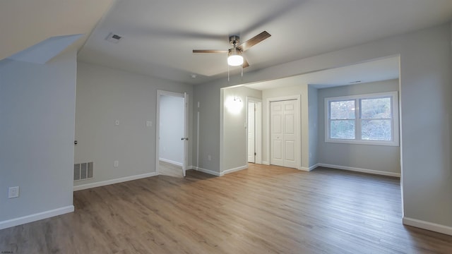 unfurnished bedroom with a closet, ceiling fan, and light hardwood / wood-style flooring