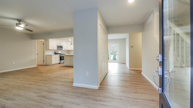 corridor featuring light hardwood / wood-style floors