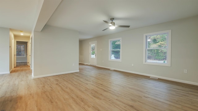 spare room with ceiling fan and light hardwood / wood-style flooring