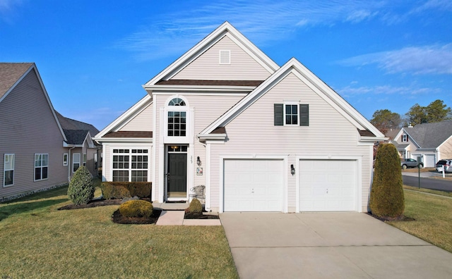 view of property with a garage and a front lawn