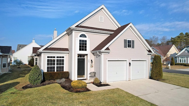 front facade featuring a garage and a front lawn