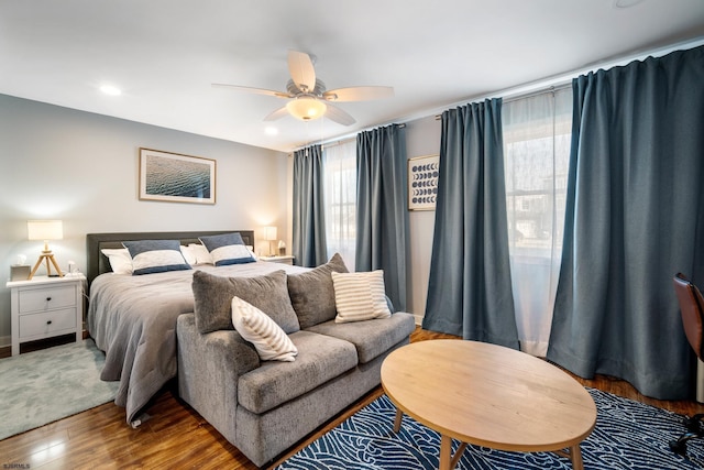 bedroom with hardwood / wood-style flooring and ceiling fan