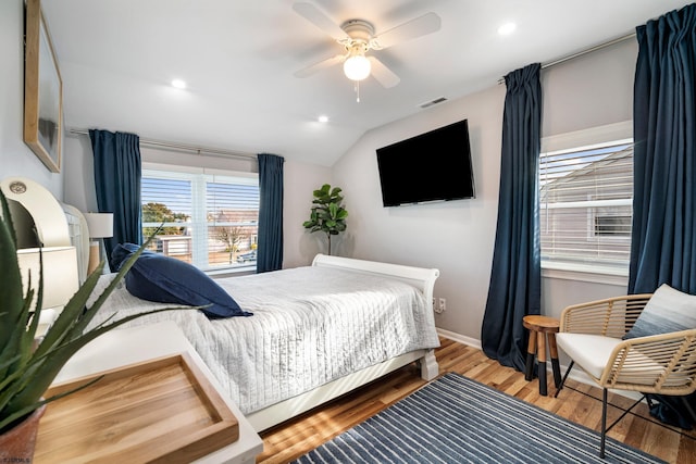 bedroom featuring vaulted ceiling, ceiling fan, and hardwood / wood-style floors