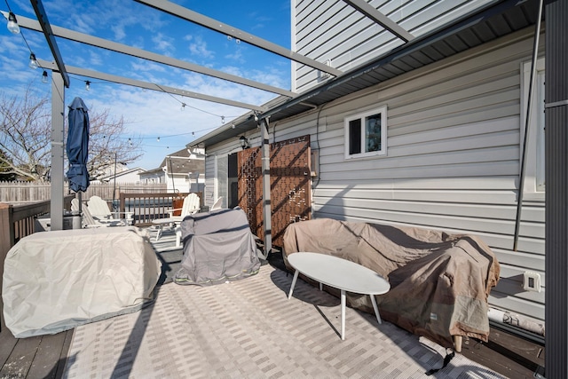 wooden terrace with a pergola