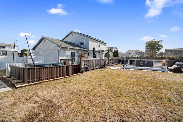 view of yard with a hot tub and a deck